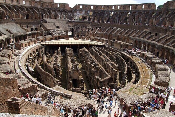 Colosseum, Forum, Palatine Hill with audio guide and Arena or Bus option - Entering the Colosseum: rings, arena edges, and dungeons from above