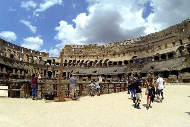 Exclusive Tour Colosseum Arena with Archaeologist & Roman Forum - Entering the Colosseum with backdoor arena access