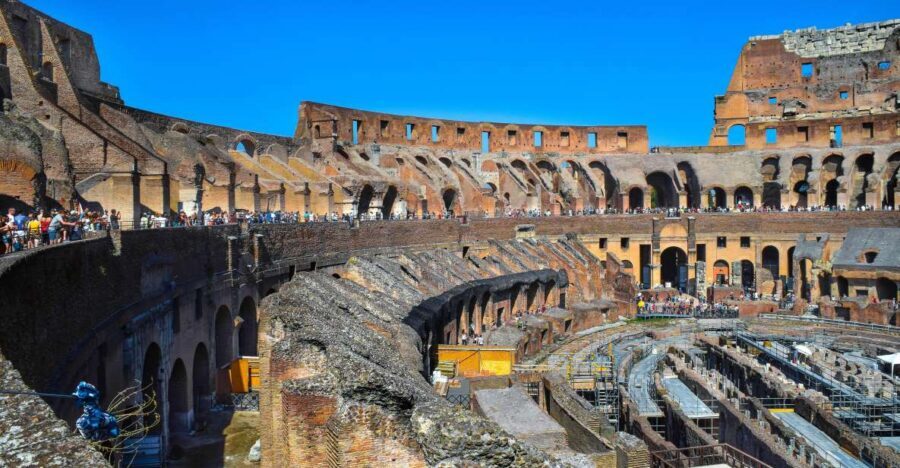 Rome: Colosseum, Roman Forum, and Palatine Hill Ancient Tour - Entering the Colosseum: rings, gladiator architecture, and the view