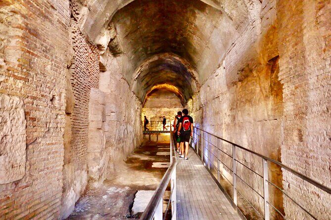 Rome: Guided Tour of Colosseum Arena with Roman Forum Entrance - Walking The Arena Floor: Porta Libitinaria And The Gladiator Steps